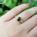 14kt yellow gold sapphire and diamond engagement ring worn on a hand
