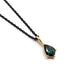 14kt yellow gold pendant with shield-cut green sapphire on a black chain, white background
