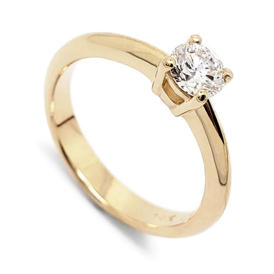 14kt yellow gold solitaire engagement ring with round Canadian diamond, angled view