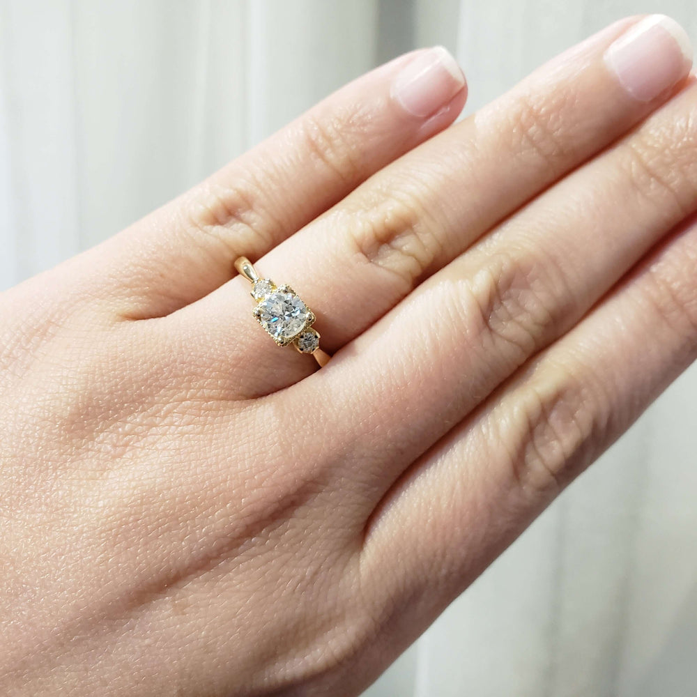 14kt yellow gold vintage diamond engagement ring worn on a hand