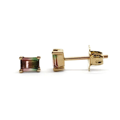 Pair of baguette cut watermelon tourmaline stud earrings in 14kt yellow gold on white background