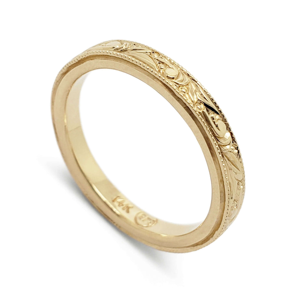 14kt yellow gold wedding ring with hand engraved scrollwork and millgrain edges