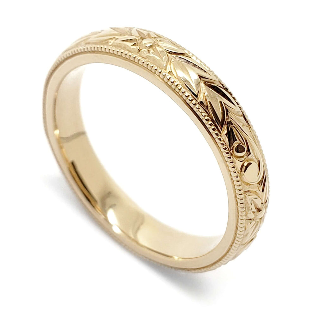 14kt yellow gold wedding ring with hand engraving and millgrain edge