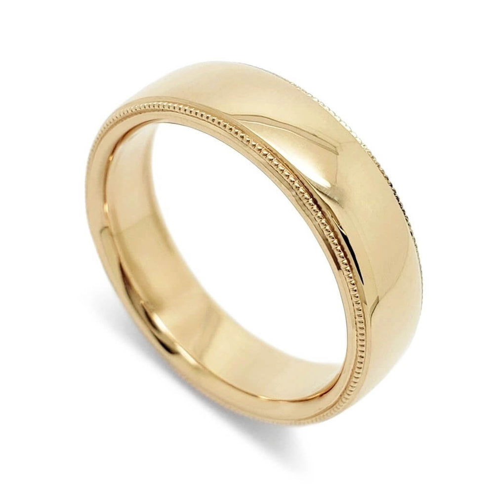 14kt yellow gold wedding ring with high polish and millgrain edge