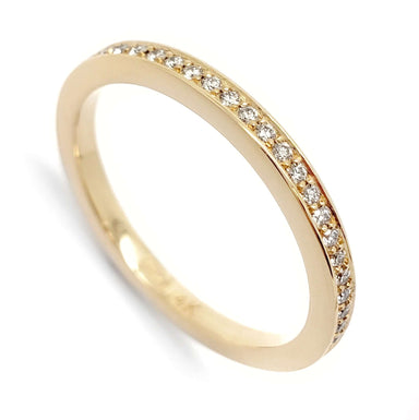 14kt yellow gold wedding ring with a row of pave-set Canadian diamonds