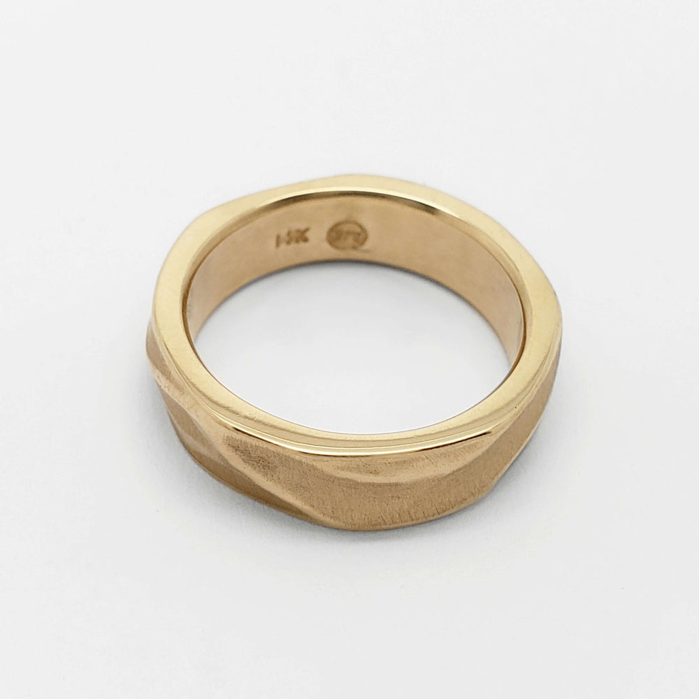 14kt yellow gold wedding ring with topography texture, overhead view