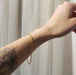 22kt yellow gold chain bracelet worn on wrist