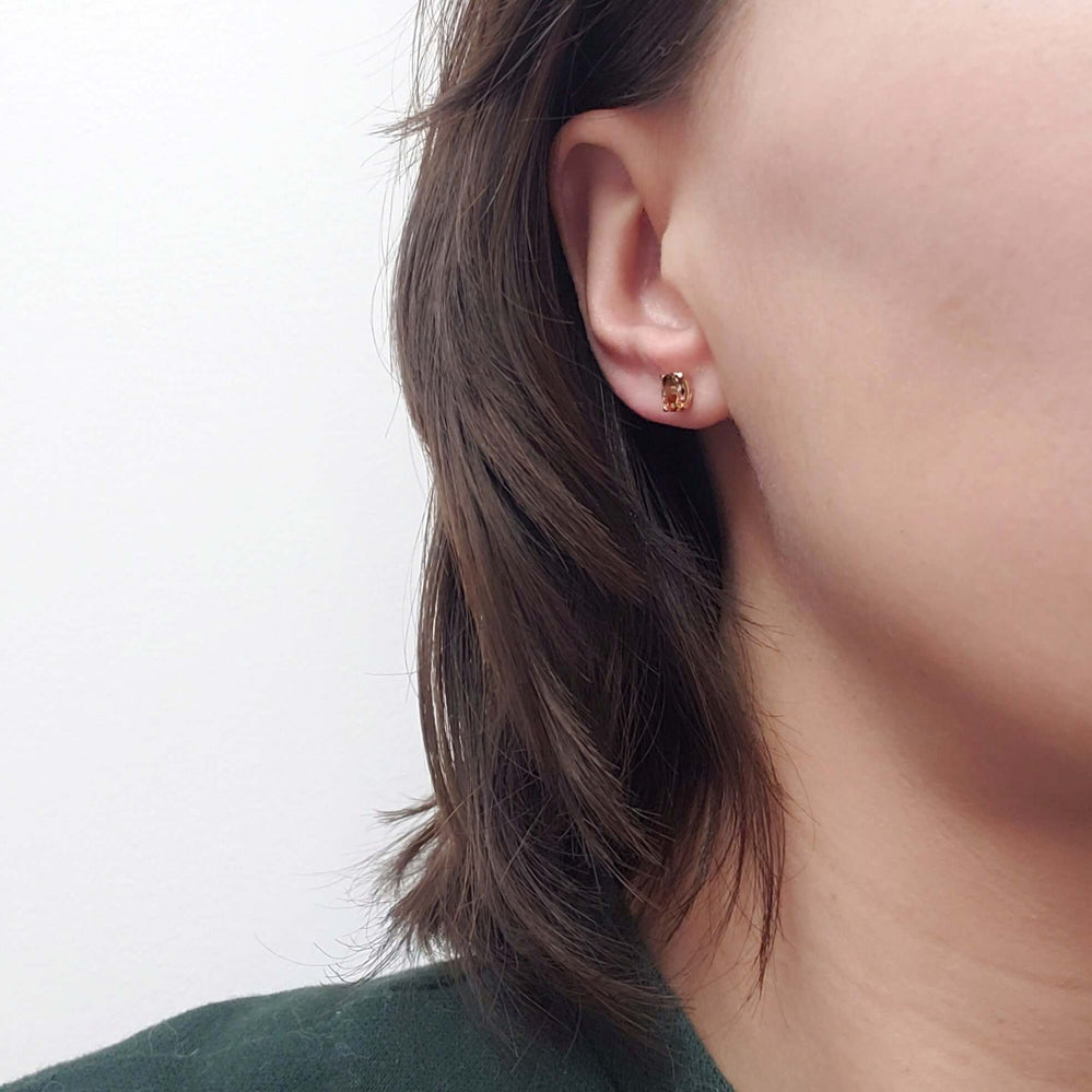 Andalusite stud earring in 14kt yellow gold shown worn on ear