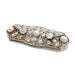 Angled view of antique platinum brooch with diamonds and pearls, vintage Edwardian style