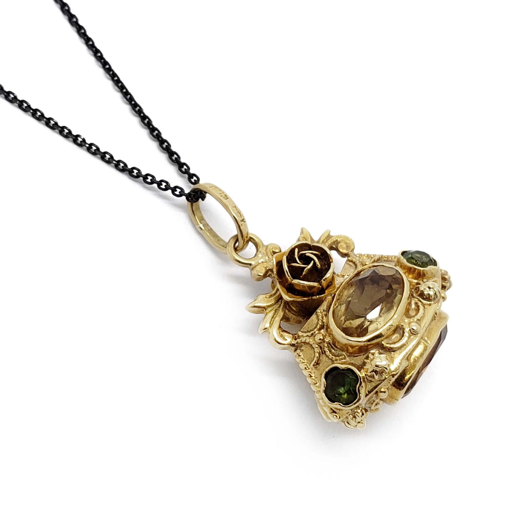 Antique 18kt yellow gold fob pendant with oval citrine and round peridot on a black chain
