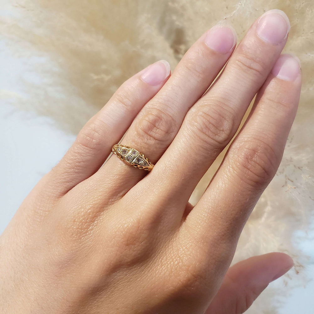 Antique 18kt yellow gold six diamond ring worn on hand