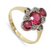 Antique Art Deco ring in 18kt gold with three round red glass stones and diamond accents