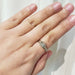 Antique diamond ring in 14kt white and yellow gold shown on a hand