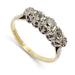 Angled view of antique five-stone diamond ring in platinum and 18kt yellow gold