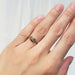 Antique floral diamond ring in yellow and white gold shown on hand