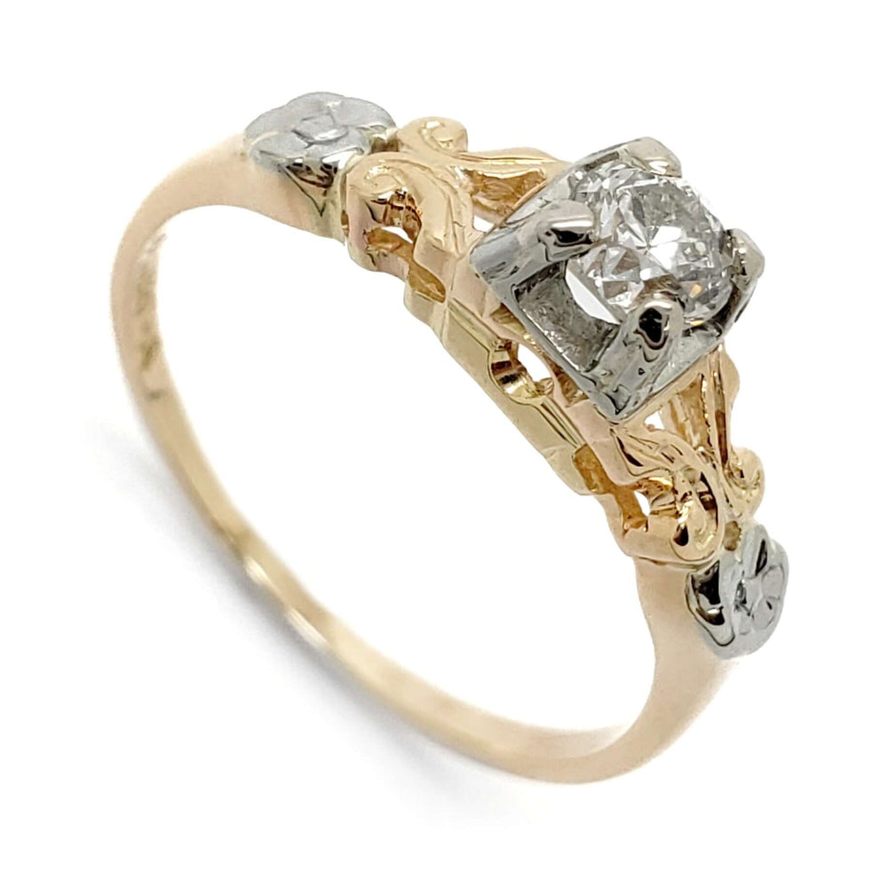 Antique floral diamond ring with 14kt yellow gold band and 18kt white gold setting, close-up