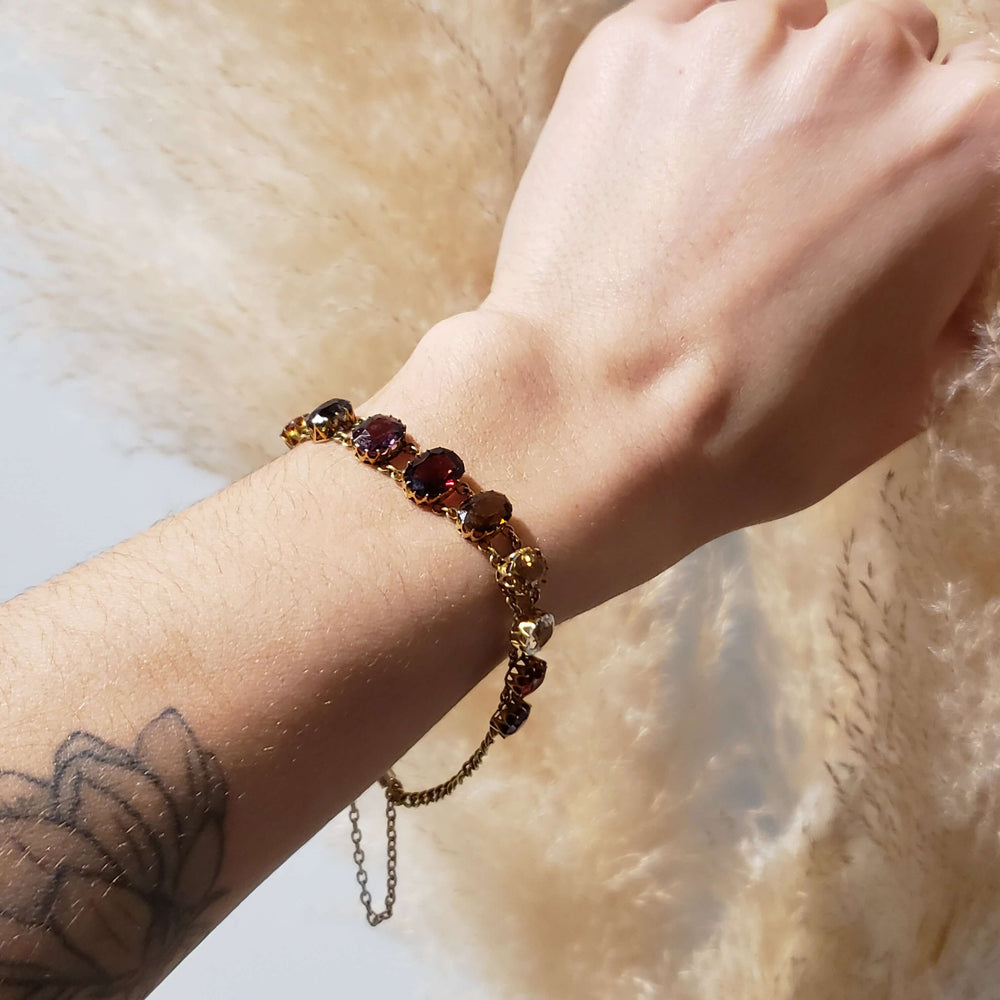 Antique multicolour gemstone bracelet in 14kt yellow gold, shown on wrist