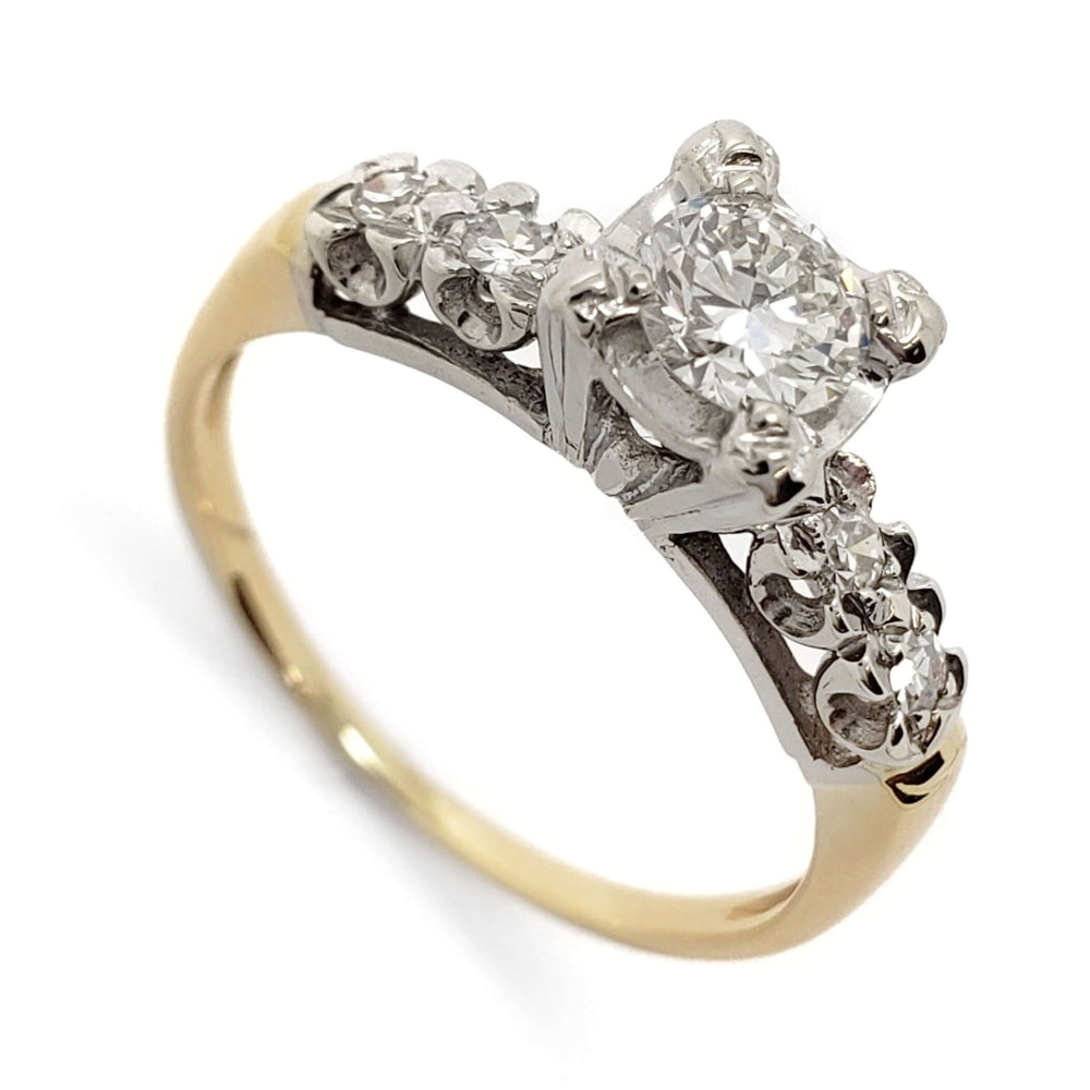 Antique illusion-set engagement ring with round brilliant diamond in white and yellow gold