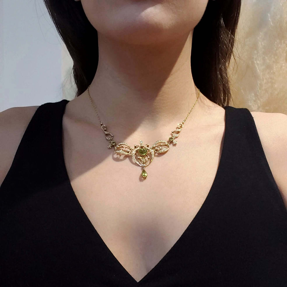 Antique peridot and seed pearl lavaliere necklace worn on model