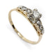 Antique two-tone gold ring with transitional cut centre diamond and four single cut side diamonds
