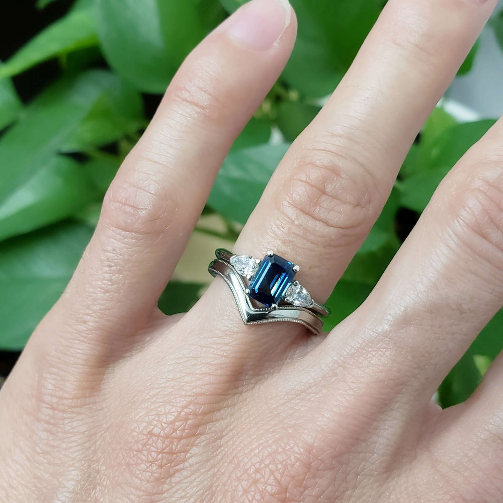 Arwin sapphire and diamond ring stacked with chevron band, worn on hand
