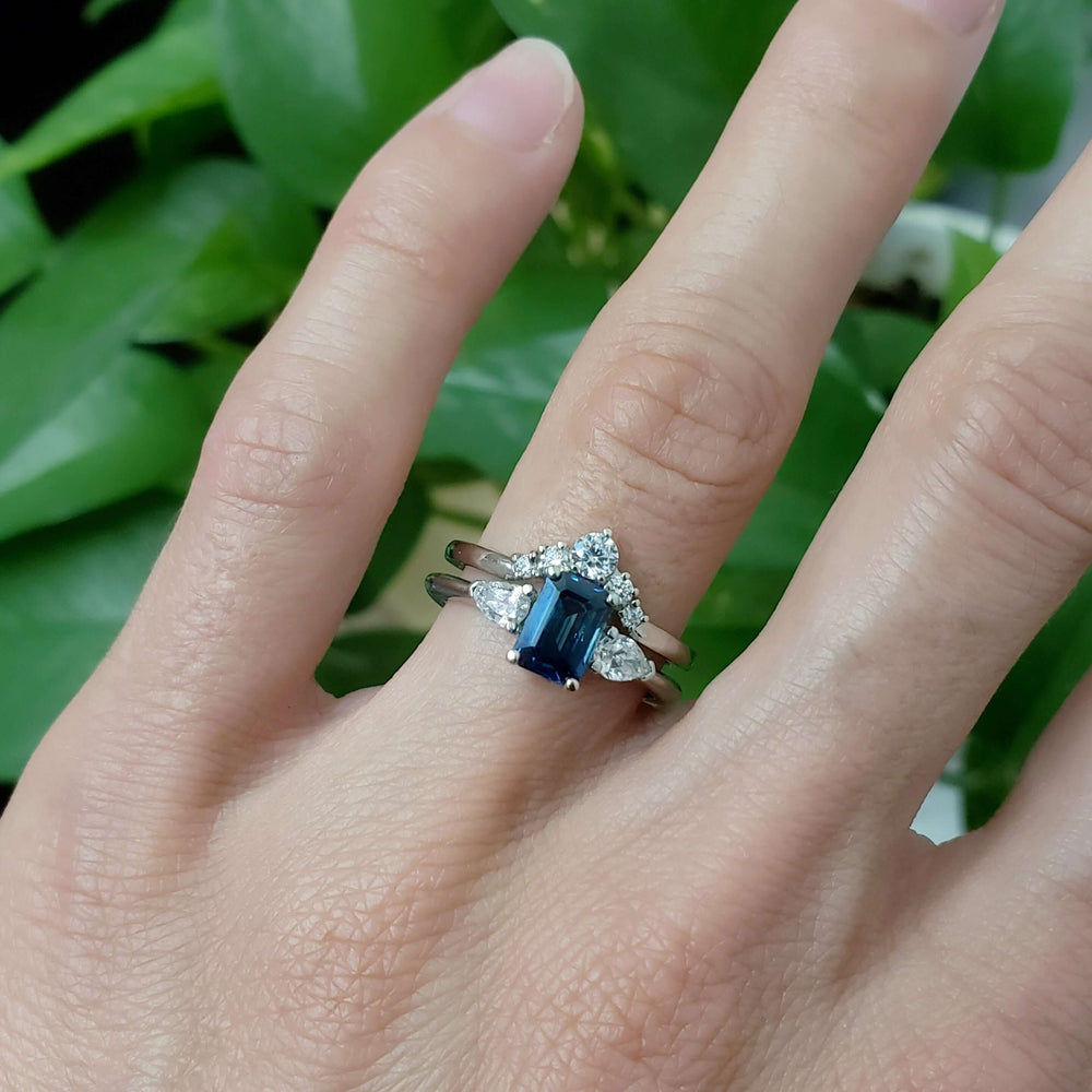 Arwin sapphire and diamond ring stacked with diamond band, worn on hand