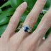 Arwin sapphire and diamond ring stacked with diamond band, worn on hand