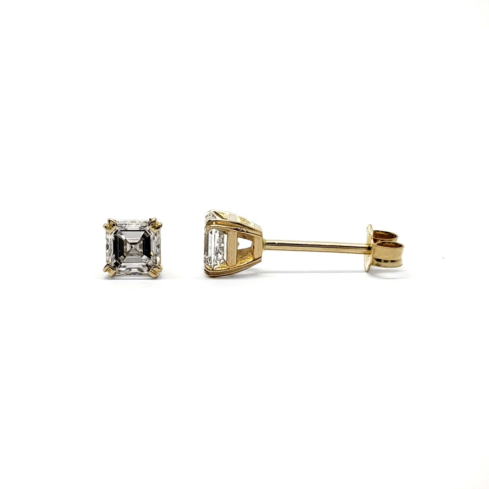 Pair of asscher cut lab diamond stud earrings in 14kt yellow gold on white background