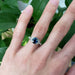 Australian sapphire and diamond engagement ring in white gold, shown on hand
