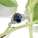Australian sapphire and diamond engagement ring in white gold, styled with greenery