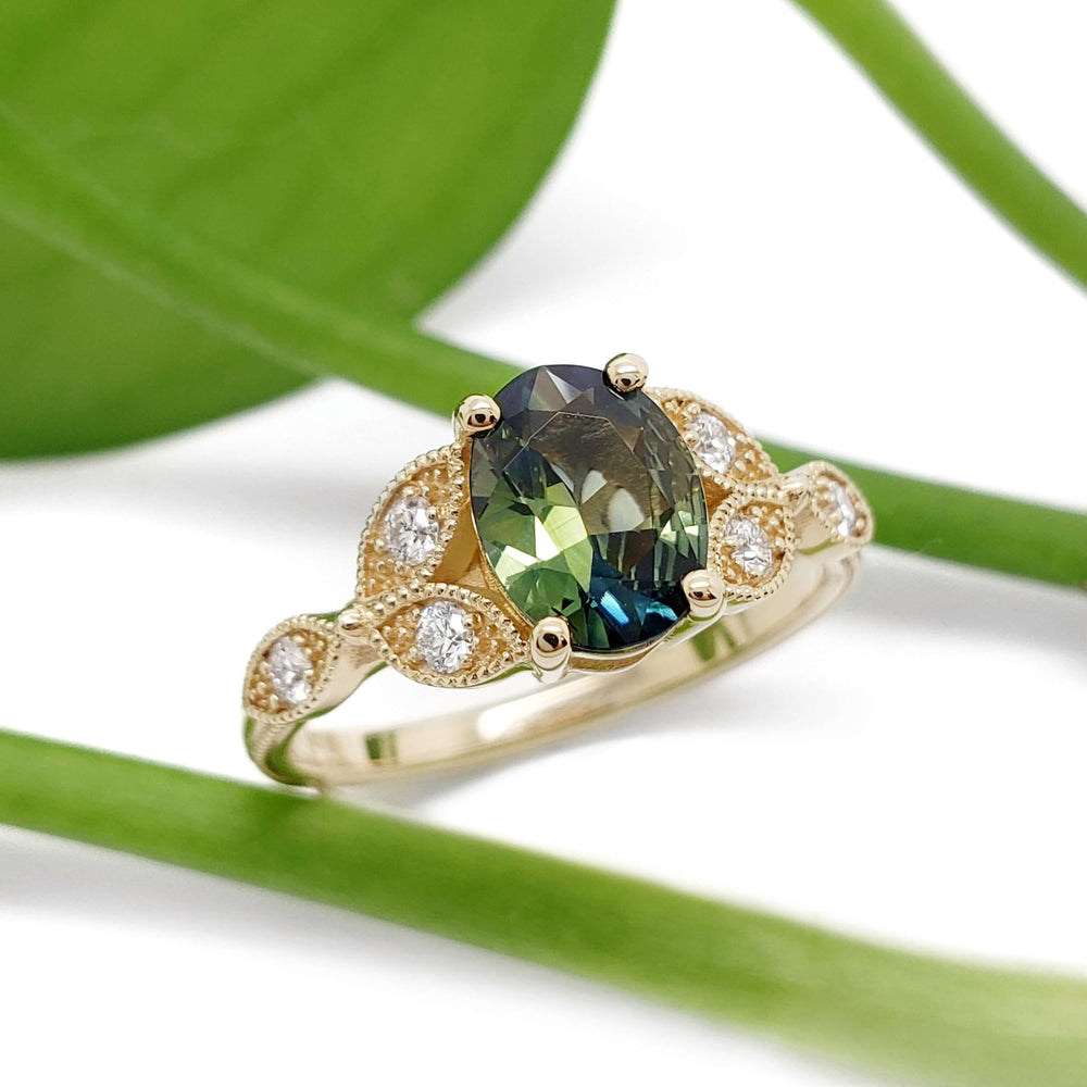 Australian sapphire and diamond engagement ring in yellow gold with leaf-inspired details