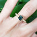 14kt yellow gold Australian sapphire and diamond engagement ring on hand, showcasing engraved band