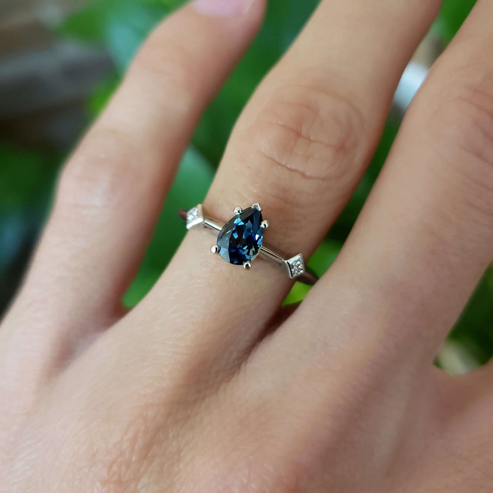 Australian sapphire and diamond ring in white gold, worn on hand