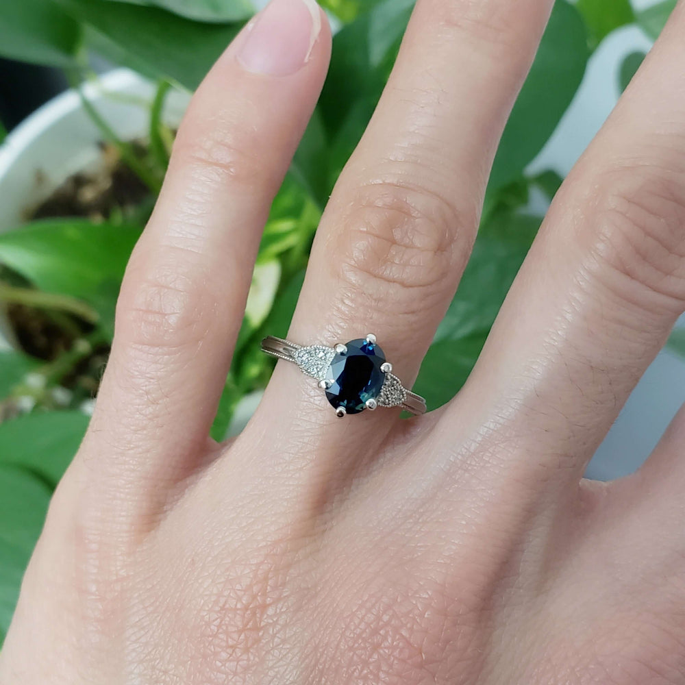 Australian sapphire and diamond white gold ring worn on hand, solitaire style