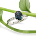 Australian sapphire and lab diamond engagement ring in white gold, styled with greenery