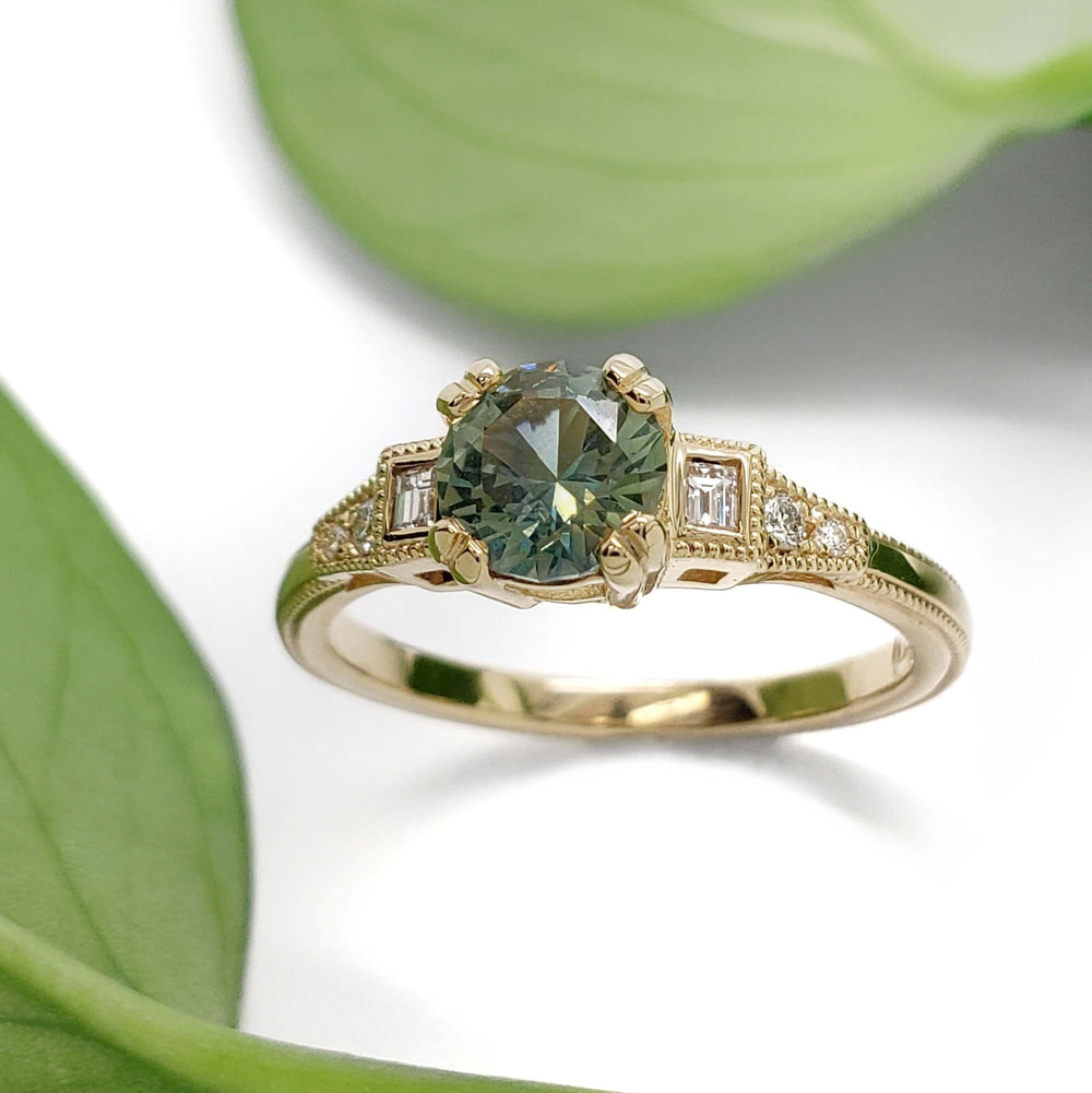 Australian sapphire and lab diamond engagement ring in yellow gold, with leaf background