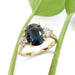 Australian sapphire and lab diamond engagement ring in yellow gold with leaf background