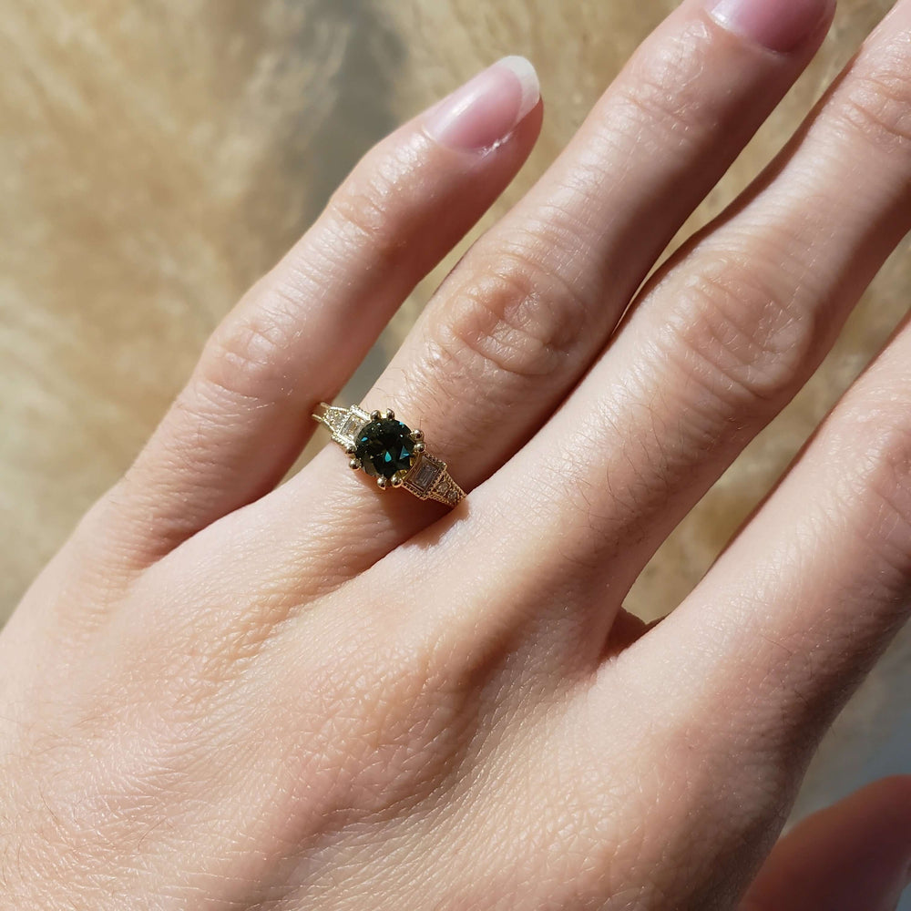 Australian sapphire and lab diamond ring in yellow gold, shown on hand