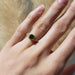 Australian sapphire and lab diamond ring in yellow gold, shown on hand