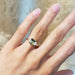 14kt yellow gold Australian sapphire and lab diamond ring worn on a hand