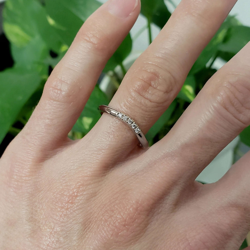 Ayala chevron diamond wedding ring in white gold on a hand