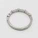 Back view of 14k white gold wedding ring with leaf and bezel set diamond details