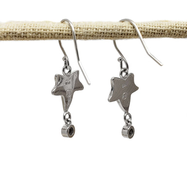 Back view of 14kt white gold leaf dangle earrings with hallmark and diamond settings
