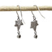 Back view of 14kt white gold leaf dangle earrings with hallmark and diamond settings