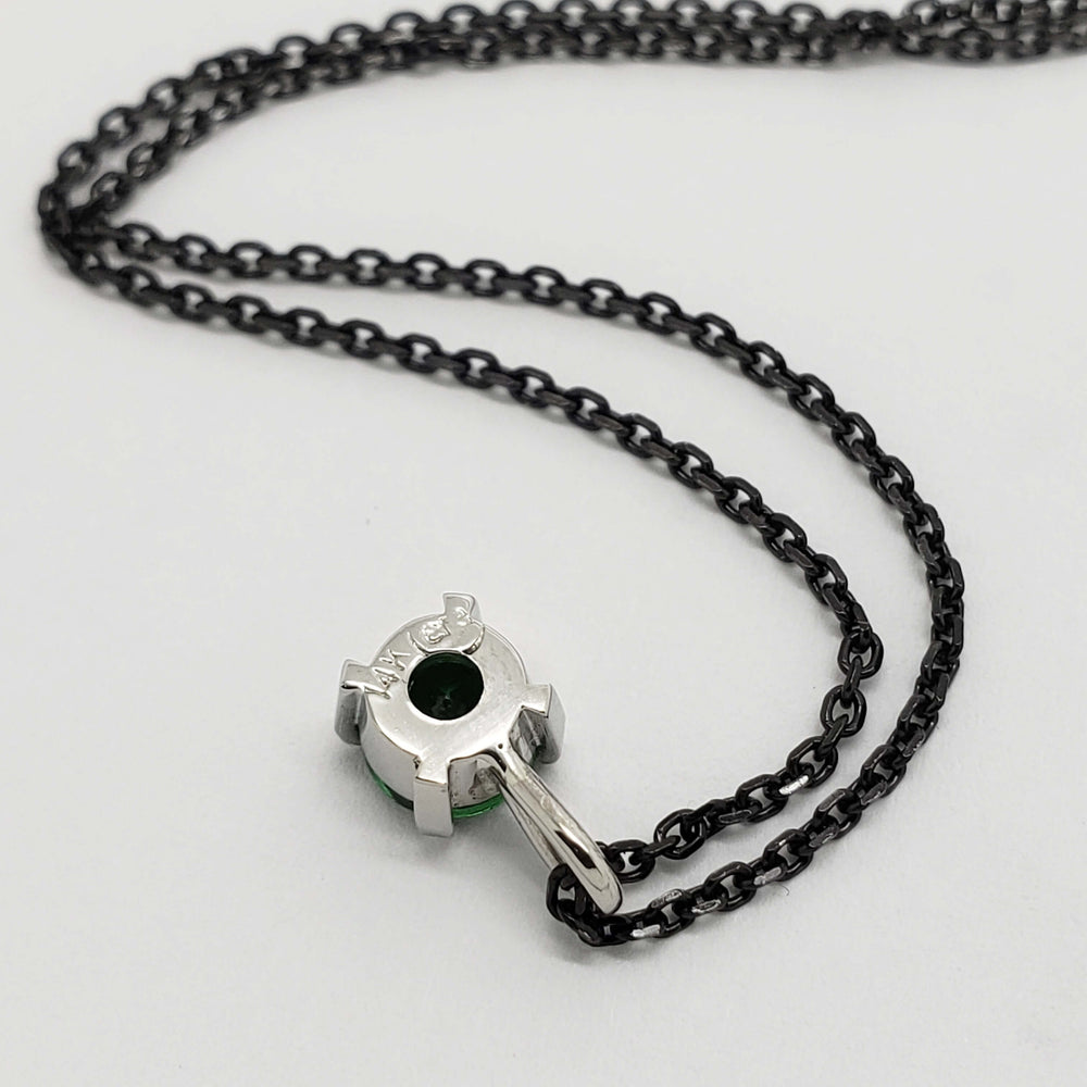 Back of 14kt white gold tsavorite garnet pendant with black chain