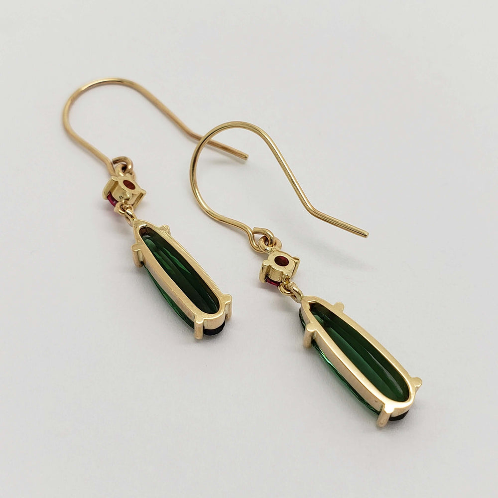 Back view of 14kt yellow gold drop earrings with green tourmaline and red spinel
