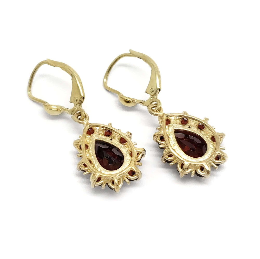 Back view of 14kt yellow gold dangle earrings with pear-shaped garnets and round garnet accents