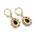 Back view of 14kt yellow gold dangle earrings with pear-shaped garnets and round garnet accents