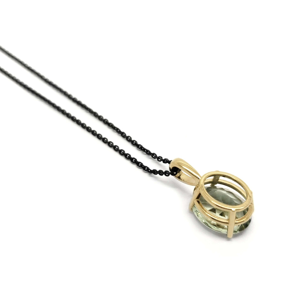 Back view of 14kt yellow gold prasiolite pendant on black chain, white background
