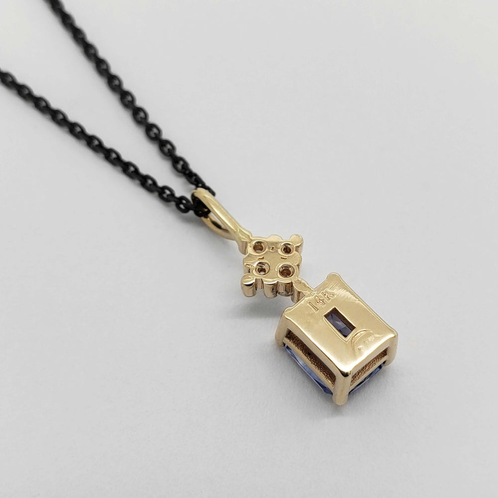 Back view of 14kt yellow gold pendant with sapphire and lab diamonds on black chain